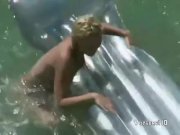 Voyeur films couple fucking in the water 1/16