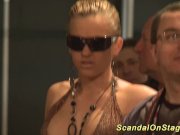 busty babe fisting on public stage 1/16