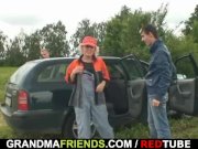 Old bitch enjoys threesome in the fields 2/16