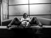 Bobbi masturbates in a corset and stockings 14/16