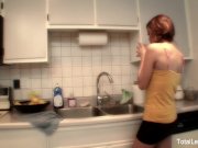 Busty MILF teaches young brunette how to cook and then some 1/16