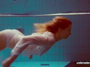 Cute Melissa plays underwater