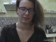 Solo girl with glasses chatting in the kitchen 1/16