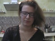 Solo girl with glasses chatting in the kitchen 10/16