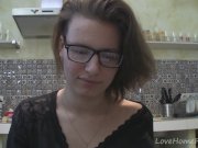 Solo girl with glasses chatting in the kitchen 12/16