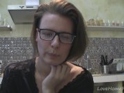 Solo girl with glasses chatting in the kitchen 13/16