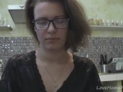 Solo girl with glasses chatting in the kitchen 2/16