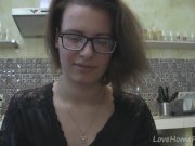 Solo girl with glasses chatting in the kitchen 3/16