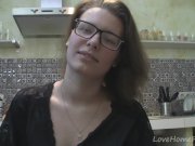 Solo girl with glasses chatting in the kitchen 5/16