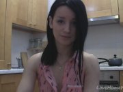 Splendid teen with glasses chatting in the kitchen