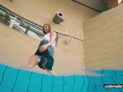 Teen girl Avenna is swimming in the pool 1/16