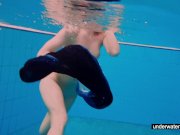 Teen girl Avenna is swimming in the pool 12/16