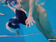 Teen girl Avenna is swimming in the pool 13/16