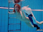Teen girl Avenna is swimming in the pool