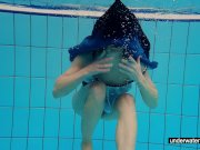 Teen girl Avenna is swimming in the pool 2/16