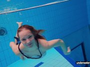 Teen girl Avenna is swimming in the pool 5/16
