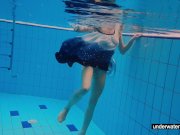 Teen girl Avenna is swimming in the pool 7/16