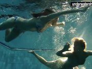 Two sexy amateurs showing their bodies off under water 1/16