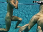 Two sexy amateurs showing their bodies off under water 14/16