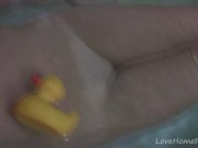 Busty teen in a bath shows her boobs 5/16