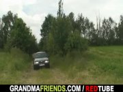 Old whore is double fucked outdoors 1/16