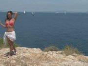 Gorgeous brunette removes her bikini on the beach 2/16