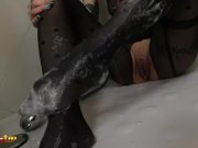Redhead in pantyhose masturbates in the shower 4/16