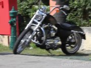 Cute blonde enjoys posing next to a bike 1/16