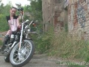 Cute teen is amazed by a big bike 11/16