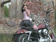 Cute teen is amazed by a big bike 16/16