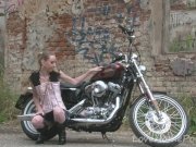 Cute teen is amazed by a big bike 5/16