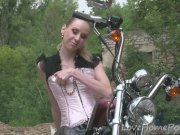 Cute teen is amazed by a big bike 7/16