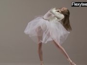 Blonde gymnast performs gymnastics 7/16