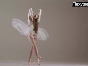 Blonde gymnast performs gymnastics 9/16