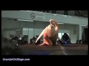 busty babe stripping on public stage 14/16