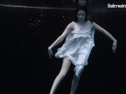 Redhead beauty in the white dress