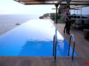 Seductive British redhead toys her pussy outside by the ocean 1/16