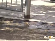 Redhead pees over her balcony in the city 15/16