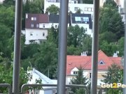 Redhead pees over her balcony in the city 2/16