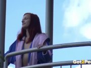 Redhead pees over her balcony in the city 3/16