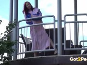 Redhead pees over her balcony in the city 5/16