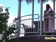 Redhead pees over her balcony in the city 6/16
