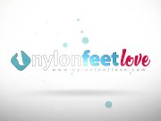 Brunette in black pantyhose shows off her feet from her car 1/16