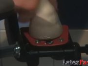 Latex mistress puts lesbian sub onto the dildo machine 15/16