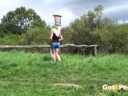 Tanned Blonde Babe Sits On Fence To Piss 3/16