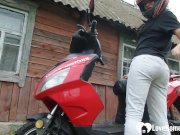 Biker girl masturbates on her red motorcycle 1/16