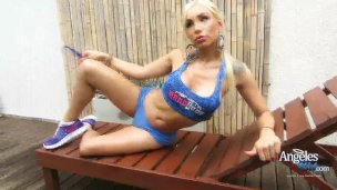 Angeles Cid posing in a sexy blue outfit