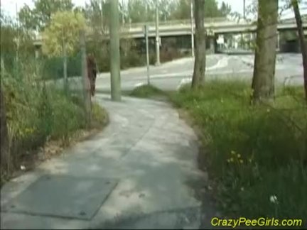 Babe in boots pissing in public