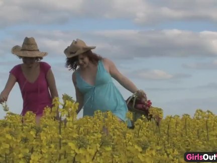 Natural lesbian girls on a canola field
