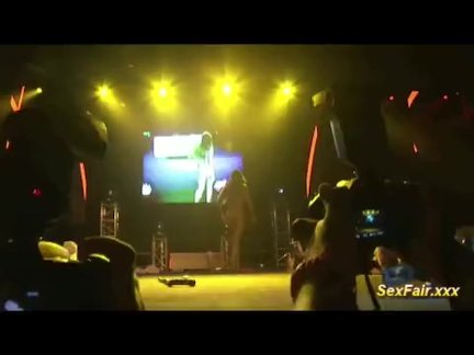 Doll fucks with dildo on stage